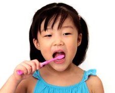 stock-footage-little-girl-looks-at-camera-and-brushes-her-teeth.jpg